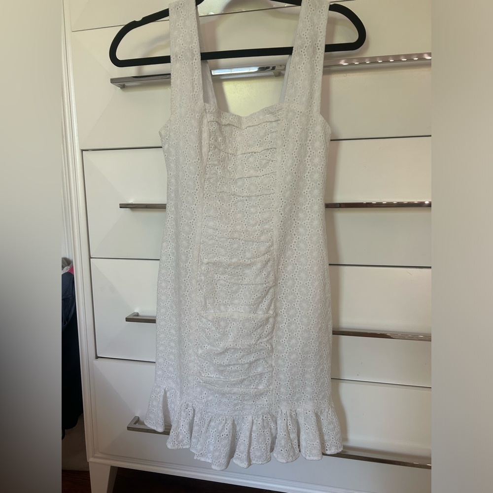 white tight dress w ruffles on bottom